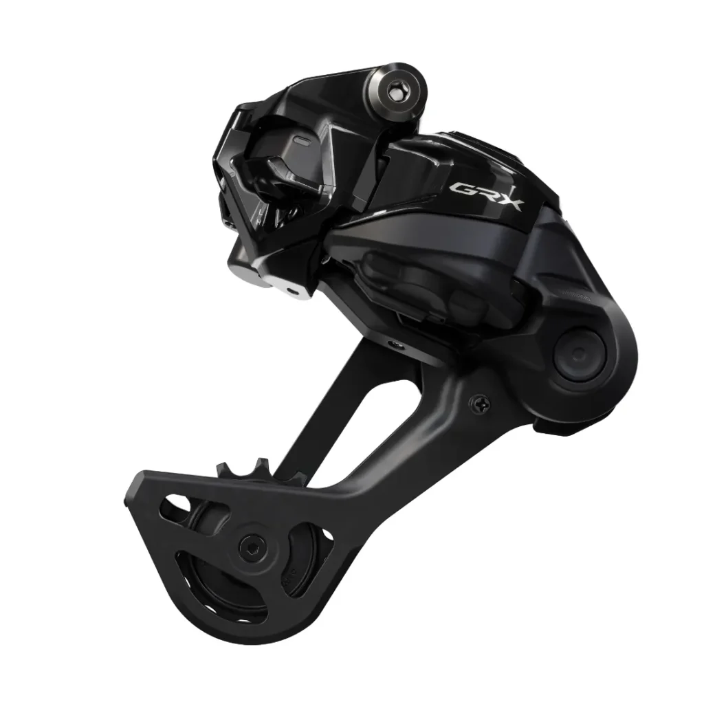 Primer plano de un cambio trasero Shimano GRX negro para bicicletas, que muestra sus ruedas de polea y su elegante diseño mecánico.