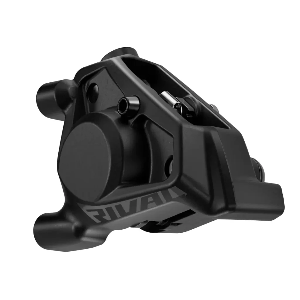 Pinza de freno de disco para bicicleta en negro mate con la marca "RIVAL", con múltiples puntos de montaje y un diseño compacto y angular, parte de las novedades SRAM febrero 2026.