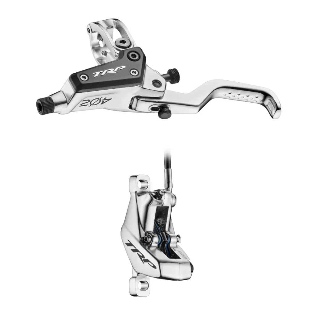 Juego de frenos de disco hidráulicos para bicicleta Silver TRP EVO PRO Anniversary Edition, edición limitada, en el que se muestra el conjunto de la palanca de freno en la imagen superior y la pinza de freno en la inferior. Disponible en la Península Ibérica.