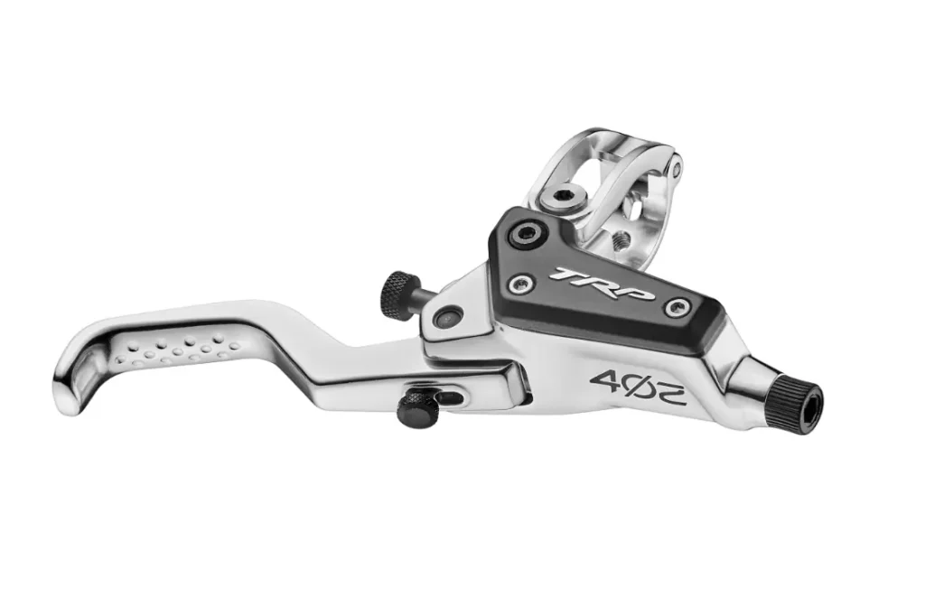 Una palanca de freno de bicicleta TRP EVO PRO 4.2 en color plateado y negro, con empuñadura texturizada y componentes ajustables, «Edición limitada» para la Península Ibérica, aislada sobre un fondo blanco.