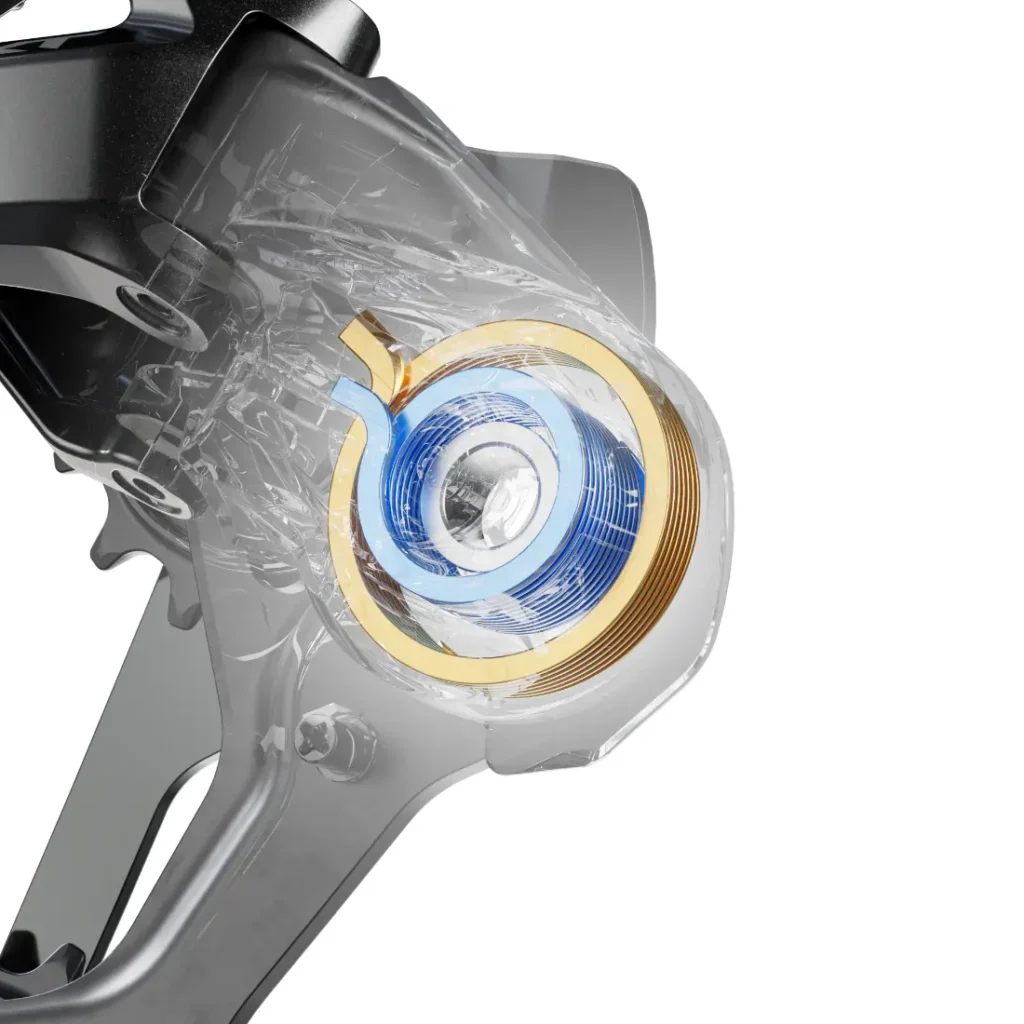 Primer plano de un componente mecánico Shimano DEORE XT M8200 con una carcasa transparente, que deja ver una bobina circular azul y dorada en el interior de la estructura metálica, diseñada para prolongar la vida útil del cable.
