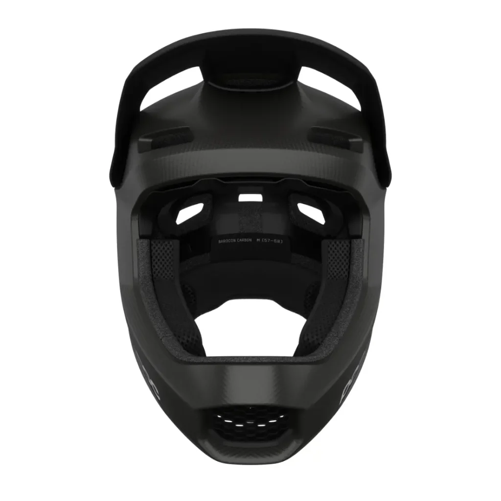 Vista frontal del casco integral POC Barocon Carbon, un casco integral de ciclismo negro diseñado para el descenso, en la que se aprecian el acolchado interior y las aberturas de ventilación.