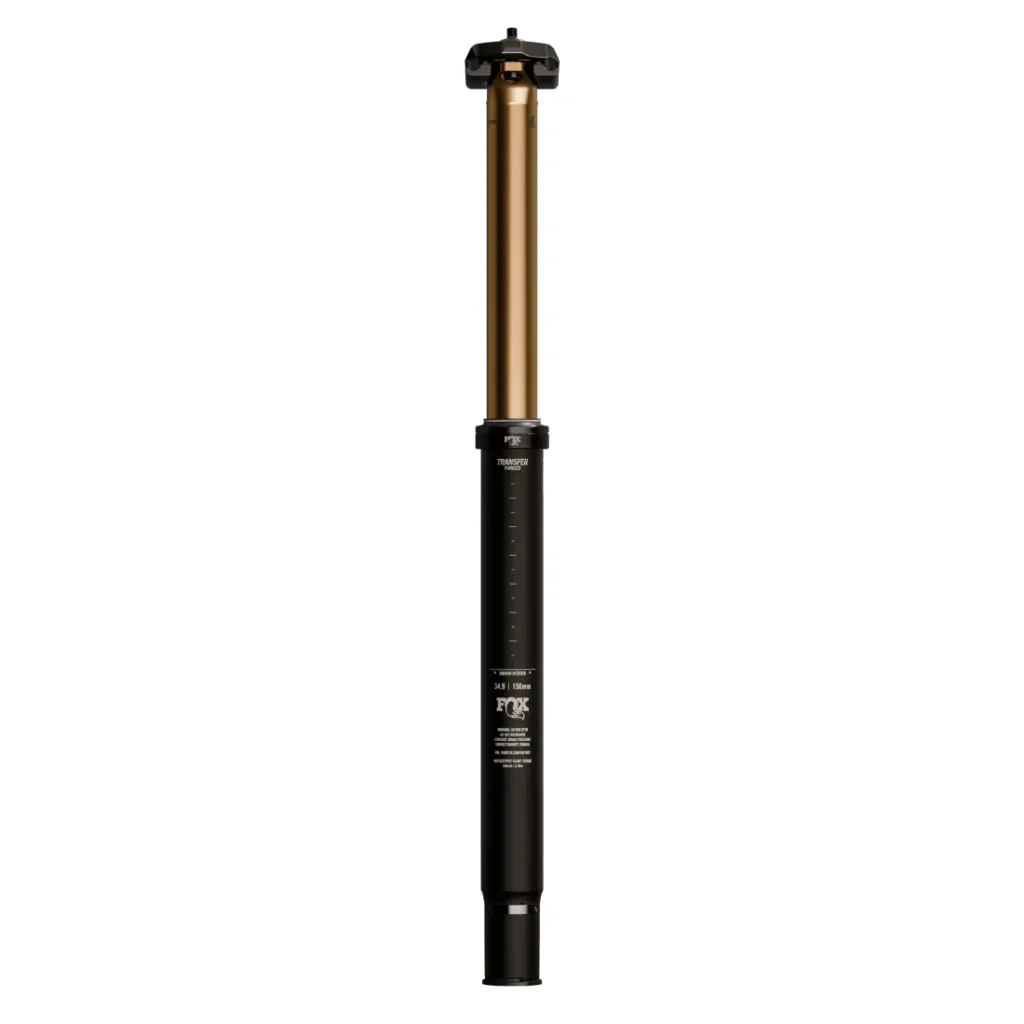 Una tija de sillín de bicicleta ajustable en negro y dorado con marcas de medición, representada en posición vertical sobre un fondo blanco; la tija electrónica FOX Transfer Neo está optimizada para bicicletas eléctricas (E-Optimized) para permitir ajustes electrónicos suaves y precisos.