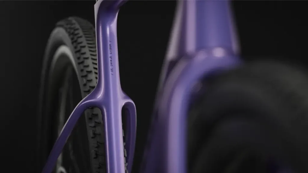 Primer plano de la parte trasera del cuadro y la rueda trasera de una bicicleta de gravel SCOTT Addict Gravel de 2027 sobre un fondo oscuro.