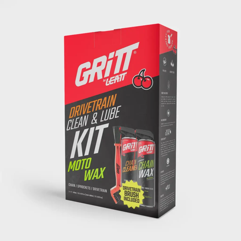 Caja del kit de limpieza y lubricación para la transmisión «Gritt» de Leatt, que contiene dos botes de aerosol y un cepillo de limpieza.