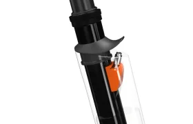 Primer plano de la tija del sillín de bicicleta UNNO MITH con una sección transparente, que revela un intrincado mecanismo interno de color naranja.