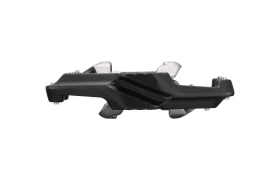 Un pedal de bicicleta Shimano DEORE XT en negro y plateado, visto de perfil, en el que se aprecian su superficie texturizada y sus componentes metálicos sobre un fondo blanco; ideal para los aficionados a los pedales SPD XC Gravel y Trail.