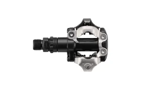 En un fondo blanco se muestra un pedal de bicicleta sin clip, en negro y plateado, con mecanismo SPD, ideal para salidas de XC Gravel con SPD.