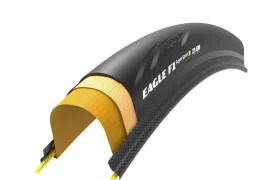 Se muestra una sección transversal de una cubierta de bicicleta denominada «Eagle F1 SuperSport», diseñada para la velocidad, con múltiples capas internas y materiales de fabricación, ideal para ruedas como la Zipp 404 S.