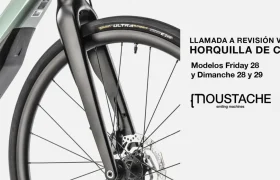 Primer plano de una horquilla de bicicleta Moustache, que destaca el retiro voluntario de los modelos Friday y Dimanche 28 y 29 debido a posibles problemas.